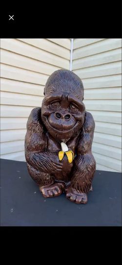 Gorilla holding banana statue