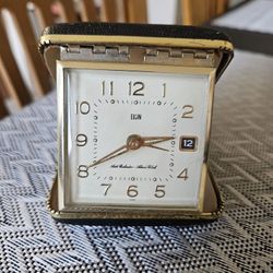 Elgin travel alarm clock, likely from the 1960s or 70s. 