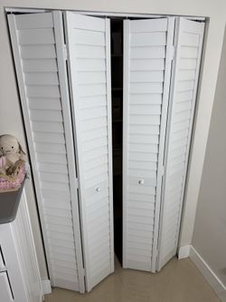 White PVC louvered bifold closet doors