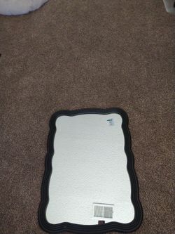 Mirror with black wood border