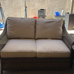 Outdoor patio wicker loveseat with cushions