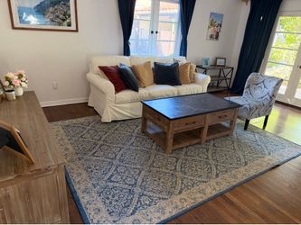 Two white pottery barn sofas