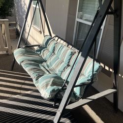 Porch swing with cushions