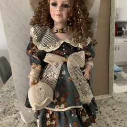 Vintage porcelain doll. 24 Inches tall with stand