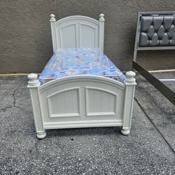 Beige Twin Size Solid Wood Bed Frame With Brand New Twin Size Plush Mattress And Box Spring In Plastic 