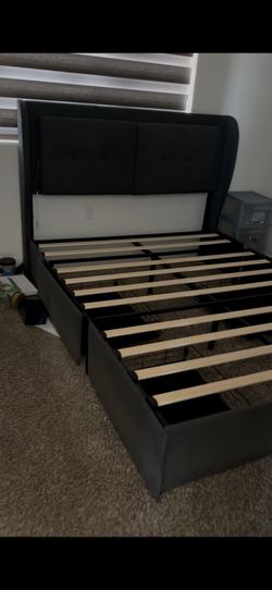 Queen bed frame with four storage drawers