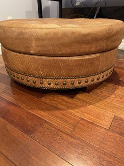 Leather beautiful ottoman  In great condition  40 by 17 hight