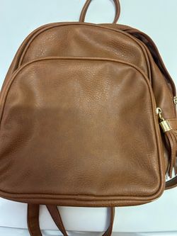 Mini brown leather backpack with adjustable straps