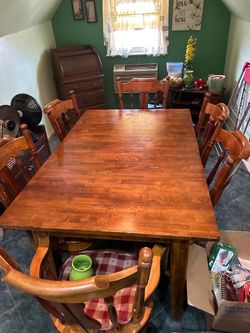 Solid wood table. Opens to 130 inches