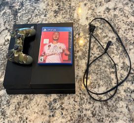 PlayStation 4 with camo controller and game