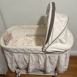 Delta Children Rocking Bedside Bassinet - Portable Crib with Lights Sounds and Vibrations, Play Time Jungle