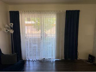 White decorative curtains with 2 navy blue panels