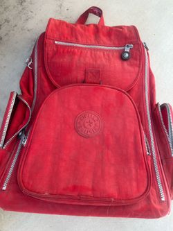 Kipling red rolling backpack