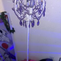 Beautiful one-of-a-kind chandelier, purple and white flicker, candles, beautiful stones all around