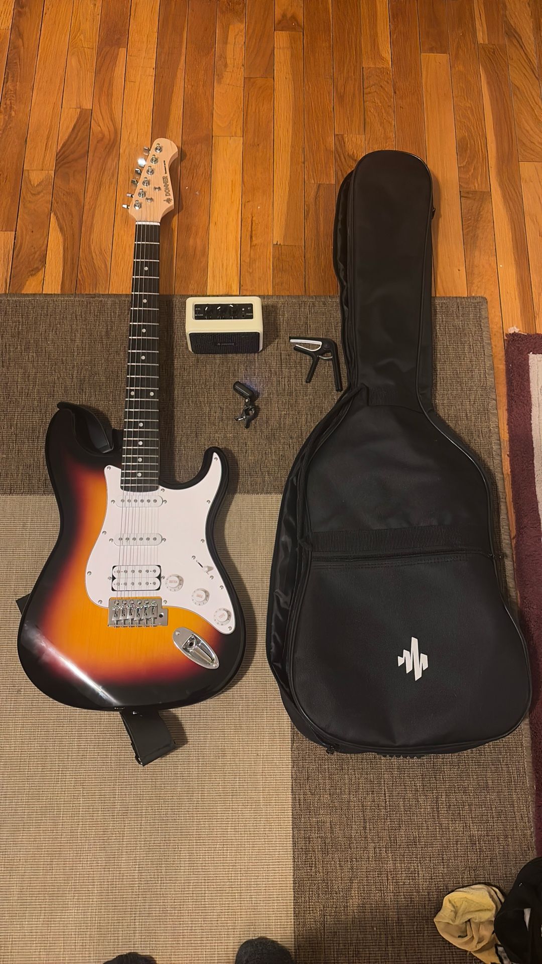 Donner Electric Guitar plus Case, Amp, Capo, and Tuner
