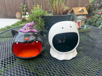 Pair of ceramic Halloween big-mouth candy bowls, featuring a black cat wearing a purple witch's hat and a white ghost.