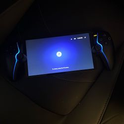 Barely used Playstation portal w/ 1 year protection plan 