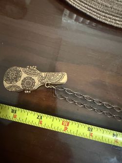 Necklace with guitar case pendant