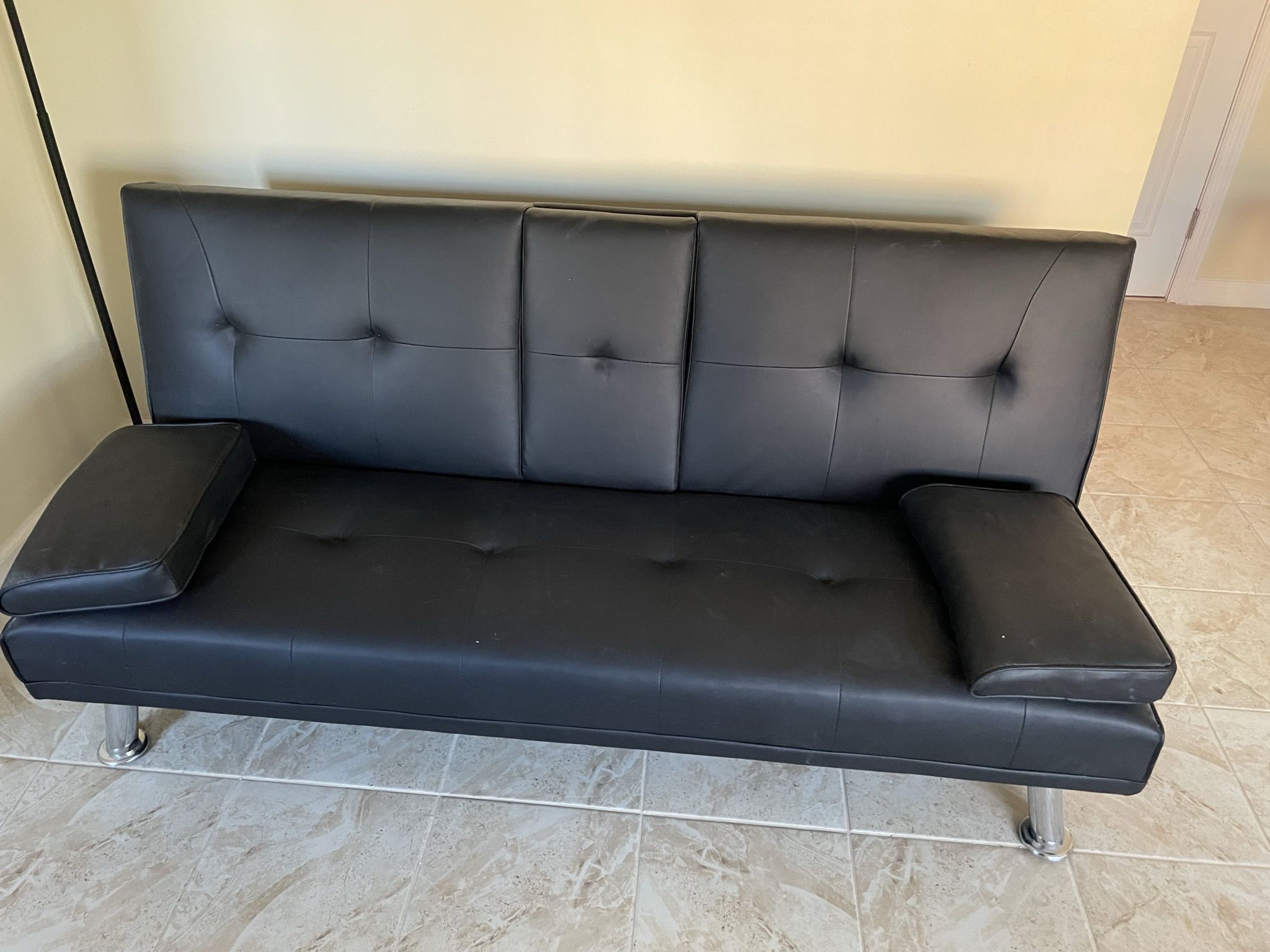 Brand New Convertible Couch Never Used.