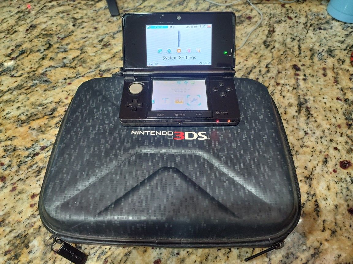 Nintendo 3ds with games and accessories.