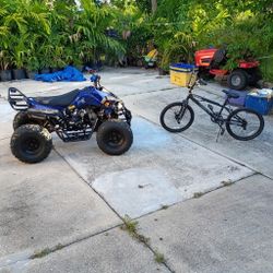 Four wheeler and Mongoose Bike