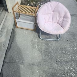 girl's pink chair and basket of toys.