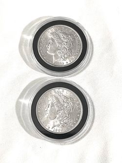 About uncirculated sealed in capsules 1885 and 1886 Morgan silver dollars. These are valued at $101 each.
