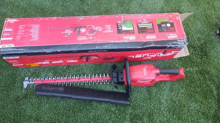 TRIMMER MILWAUKEE COMMERCIAL!!   BRAD NEW!!  USED ONLY  ONE TIME!