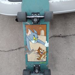 Almost skateboard Tom/Jerry good shape no offers no trades 75 Ave Indian School serious buyers only please