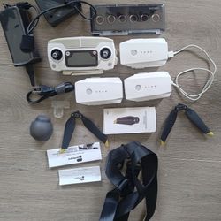 The DJI box is misc. drone remote, 3 batteries & charger and Misc parts w case