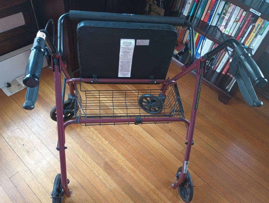 Walker with Seat on Four Wheels
