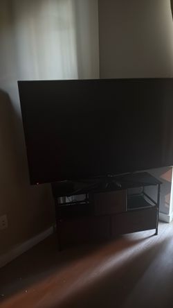 Large TV and stand $100