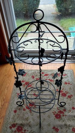 Vintage wrought iron wine rack.