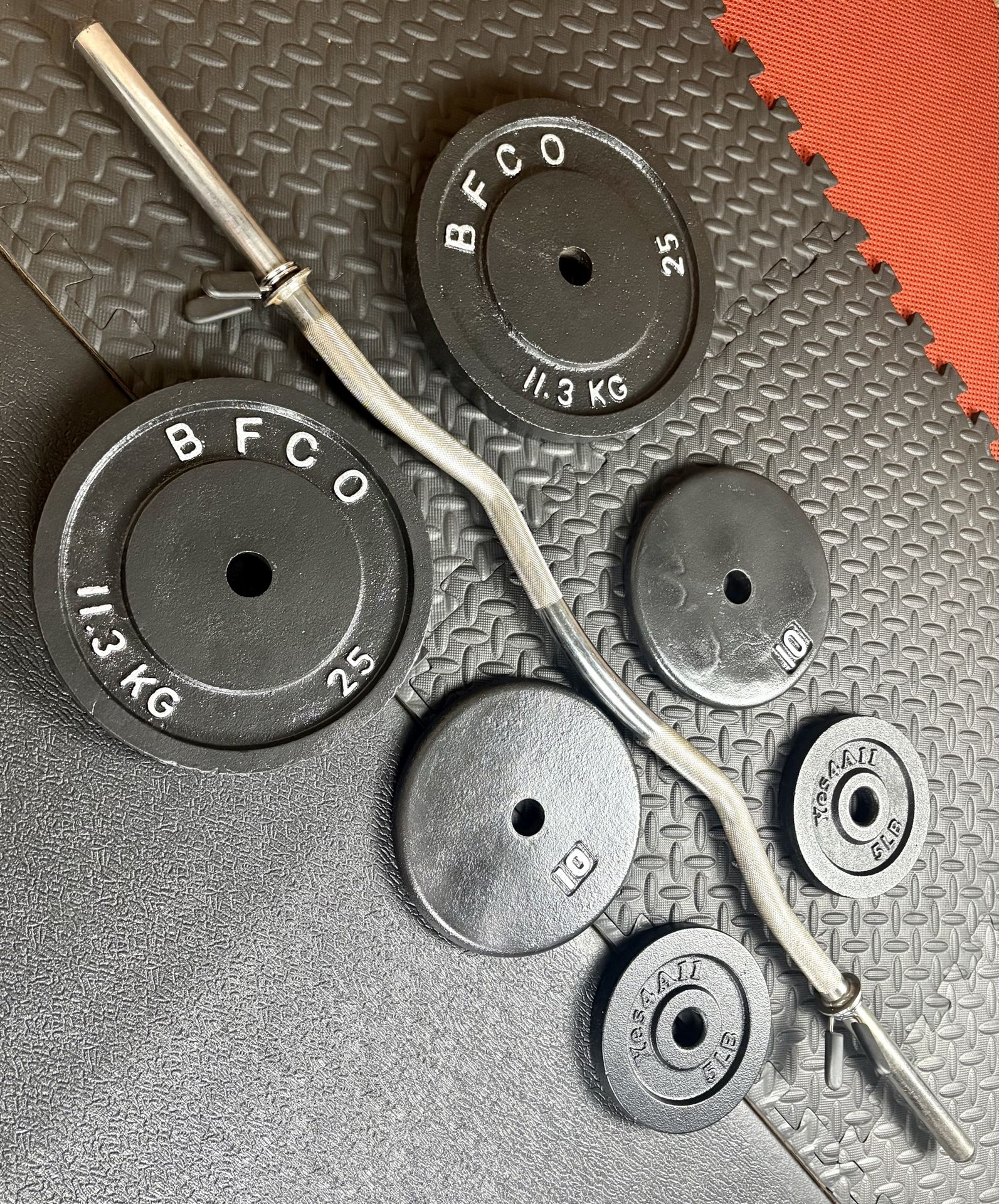 Standard Curl Bar W/Weight Plates: 25s, 10s and 5s pounders. 85# Brute W.