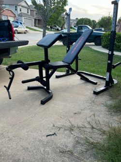 Squat rack bench with leg extension leg curl can also workout biceps