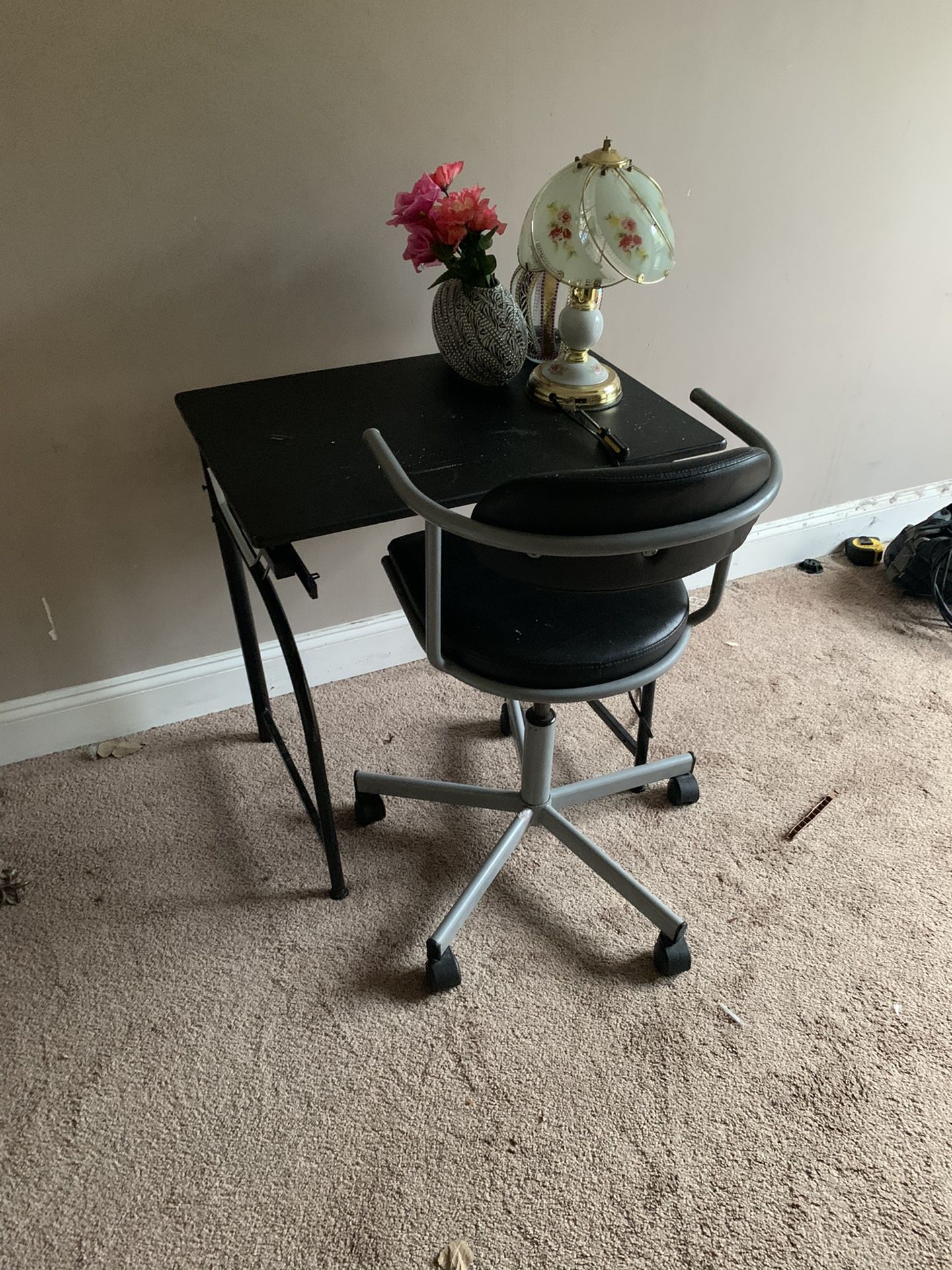 A computer desk along with a chair