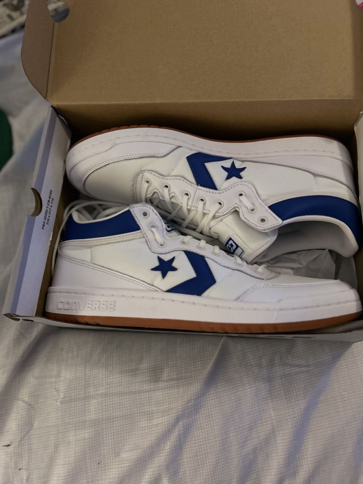 White Converse With Blue Trim
