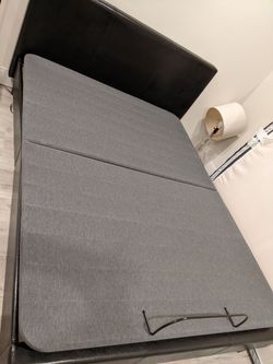 Queen bed with leather headboard