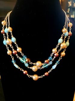 $10. Three strand faux pearl and blue glass bead necklace. Choker necklace. 16 inches but extends up to 18 in.