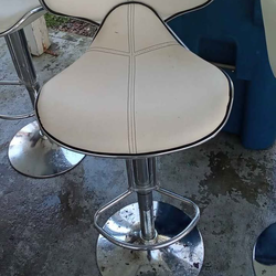Two white bar stools