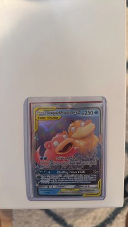 Both SlowPoke/Psyduck and Reshiram/Charizard Tag Team GX Pokémon cards