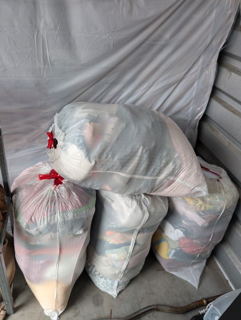 Bags of clothing, containing 40 pieces each with clothing and mixed sizes for women, men and girls. $10 each.