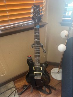 Barley used PRS SE 7 string, stand and pickups