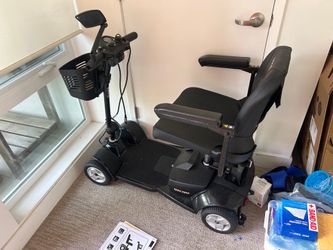 Electric wheel chair scooter excellent un used condition priced to go