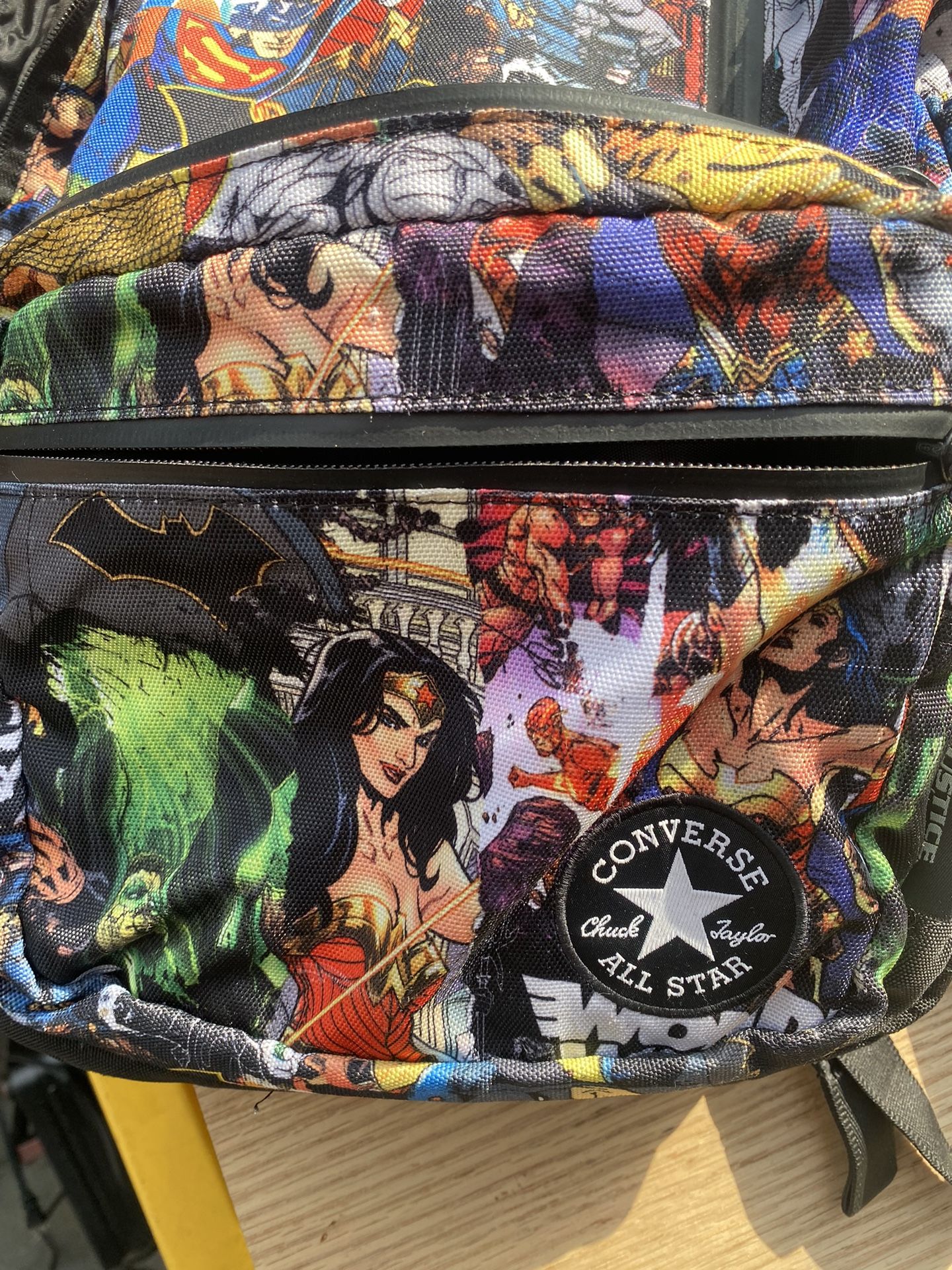 Converse Chuck Taylor All Star backpack, featuring a Justice League comic book print. It appears to be a licensed product from the early 2000s when Co