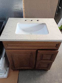 30" vanity  display,  faucet brush nickel, fixtures light wall