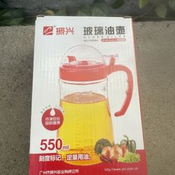 ZHEN XING glass oiler/dispenser bottle with a red lid and handle, mode 