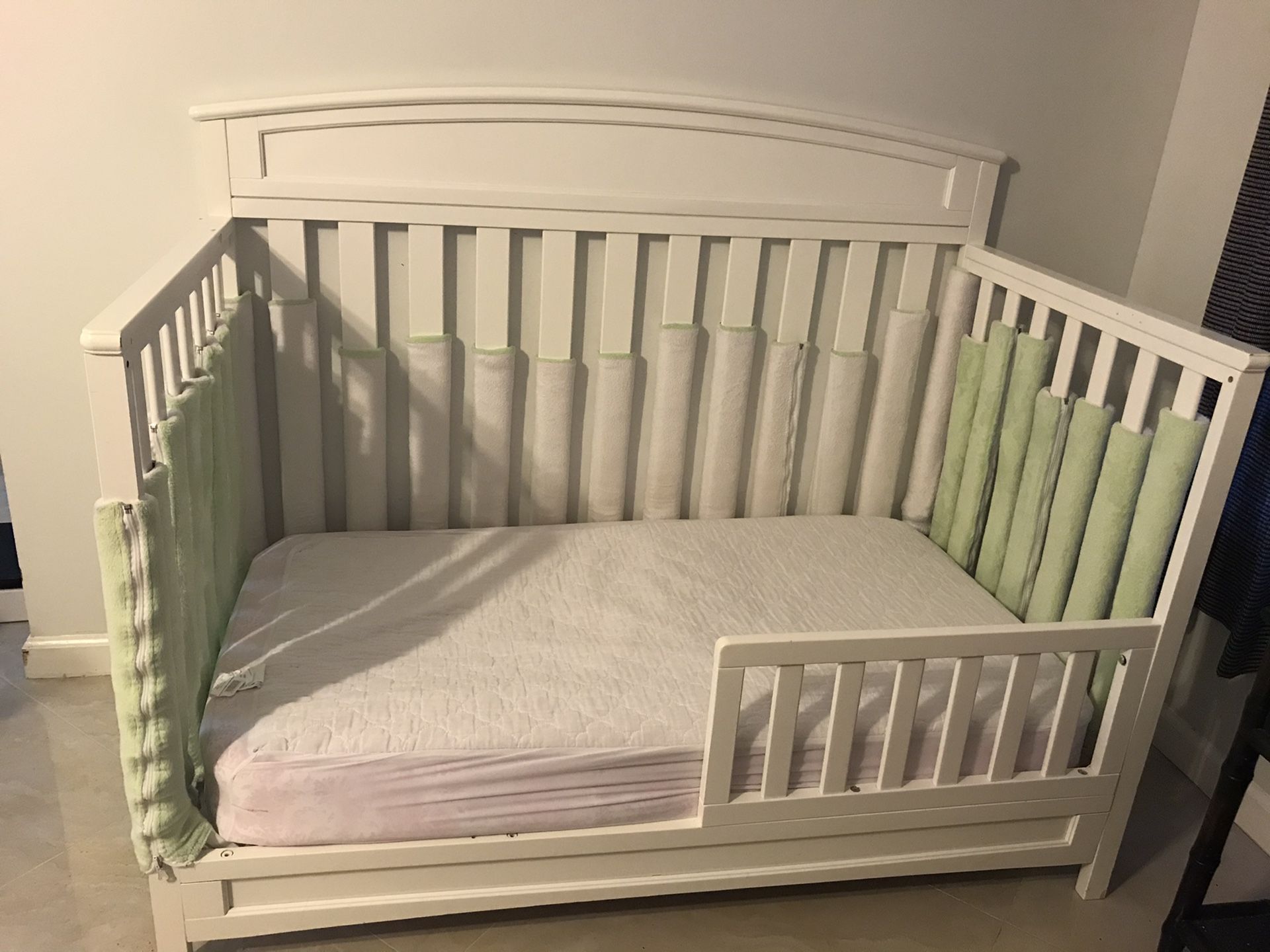 Delta white wood toddler bed (mattress included) which can convert into