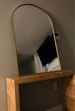Large arched gold mirror