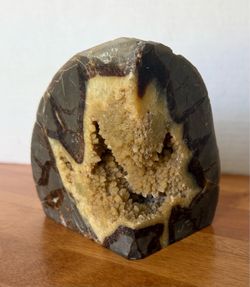 Large septarian Geode. Weighs 3.5 pounds. Measures 5” by 5”.